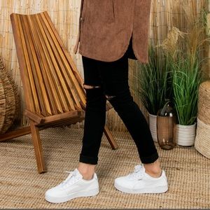 Brand new, never been worn Puma Carina sneakers